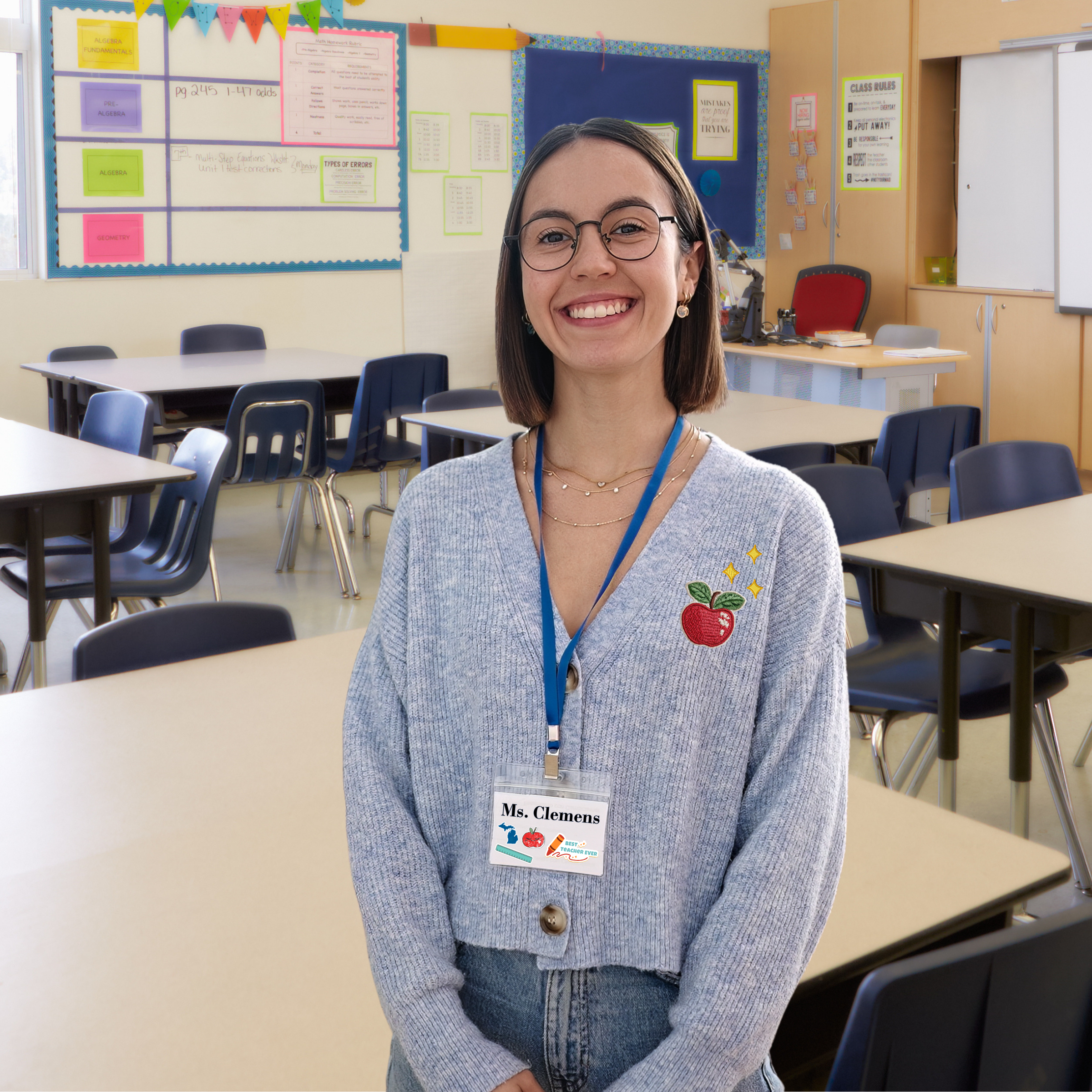 Female educator standing in her elementary school classroom